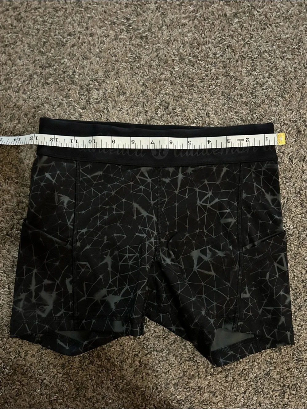 Lululemon What The Sport shorts in a black and grey geometric pattern 4”